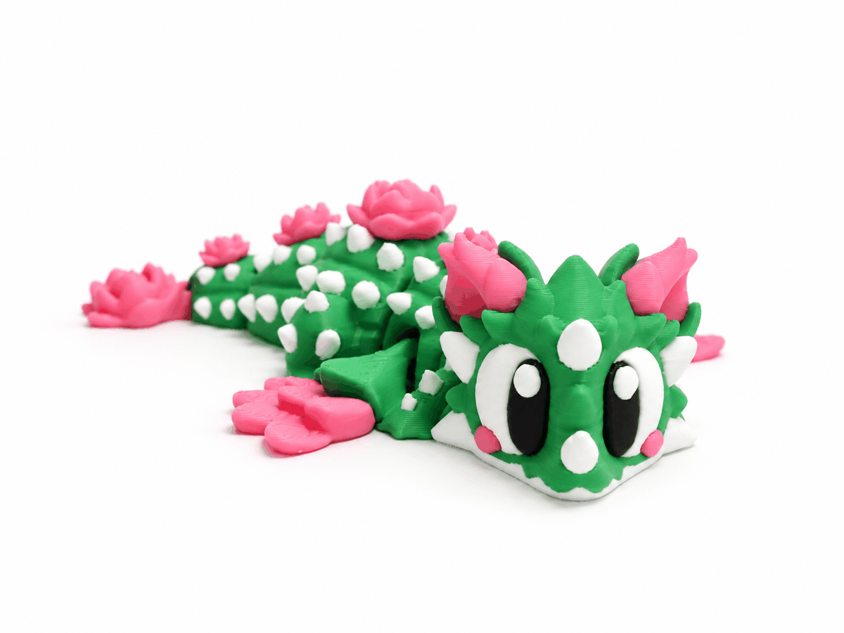 Beweglicher Kaktusdrache mit weissen Stacheln und Rosen in Seitenansicht