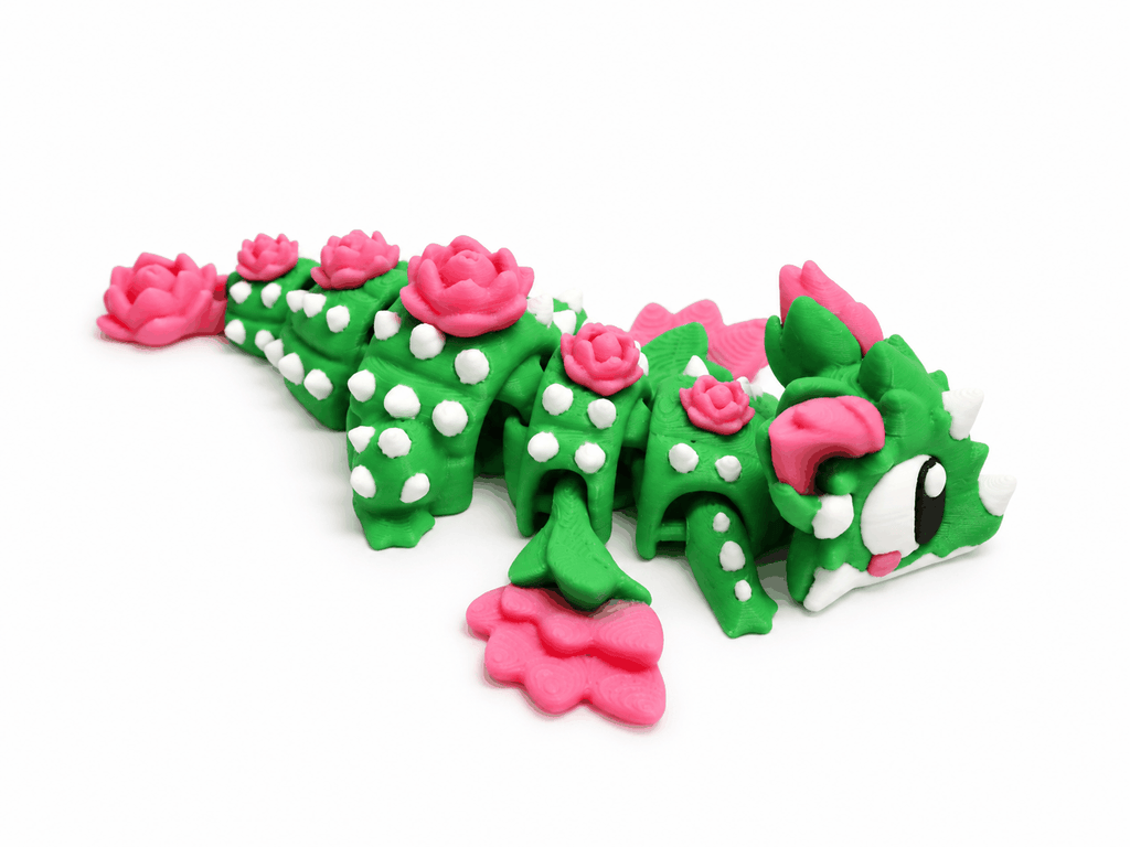 Rosenkaktus Drachenfigur von vorne mit grossen Augen und pinken Hörnern