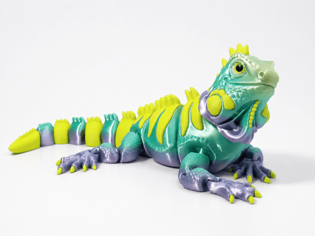 Leguan Neonstachel als bewegliche 3D-Figur in Türkis und Grün mit violetten Beinen, gelben Akzenten und Rückenkamm