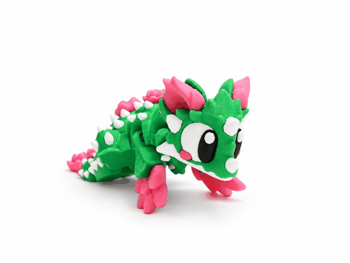 ProtoDrache Rosenkaktus – beweglicher grüner Kaktusdrache mit pinken Rosen und weissen Stacheln